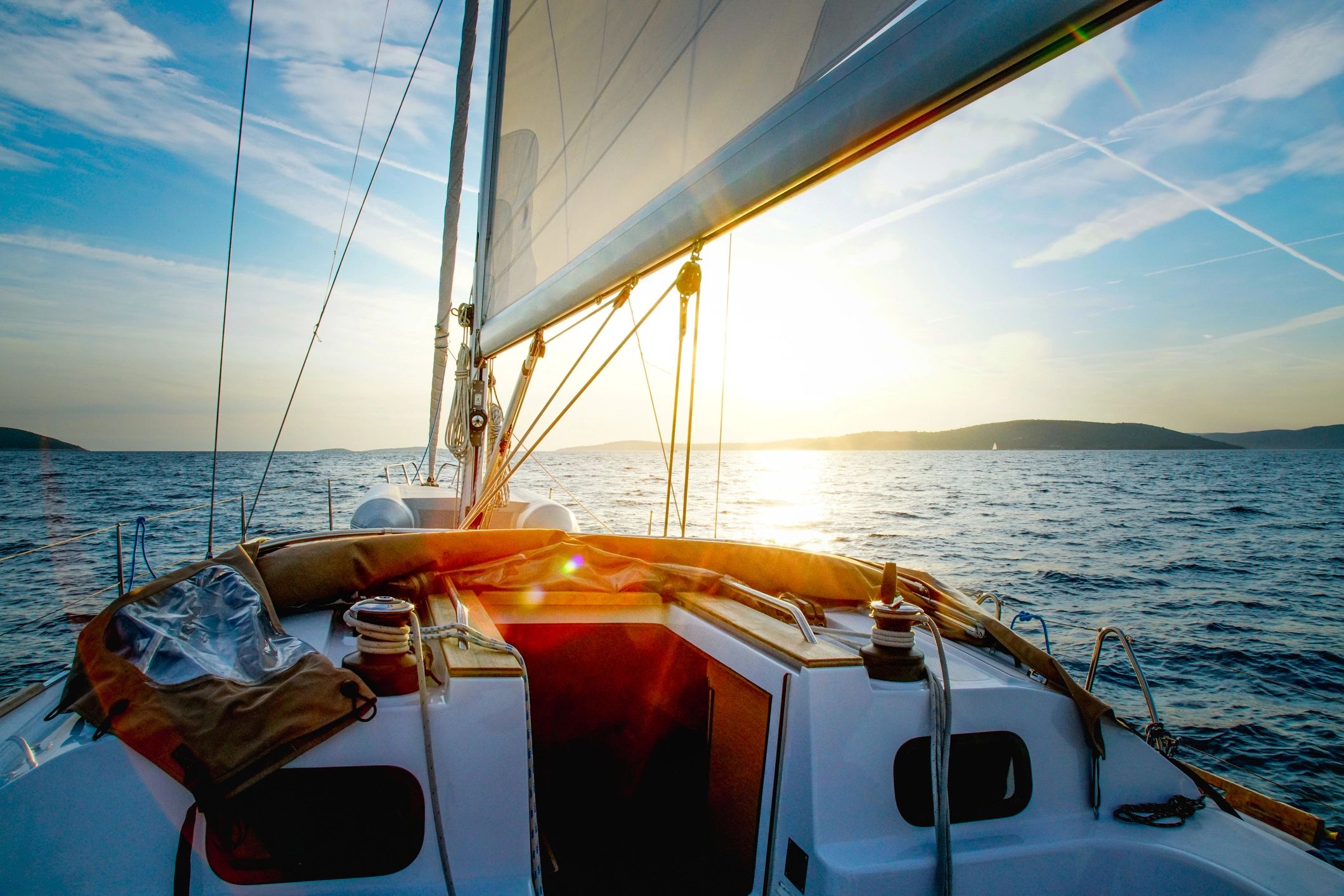 Sailboat crossing at dusk