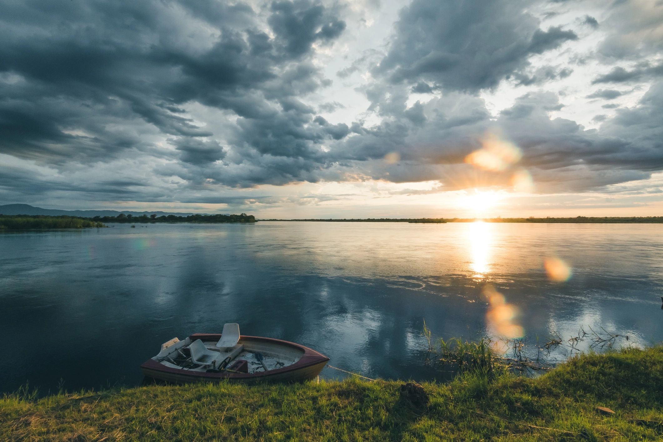 Boat resting at dock at sunrise