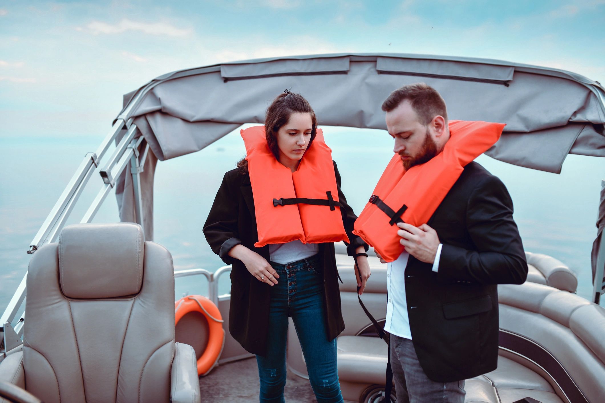 Boaters practicing a life vest drill on a catamaran