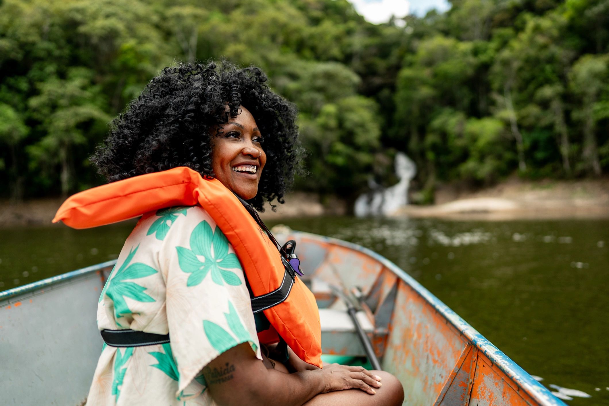 Boater on a river wearing a life jacket during a boat ride