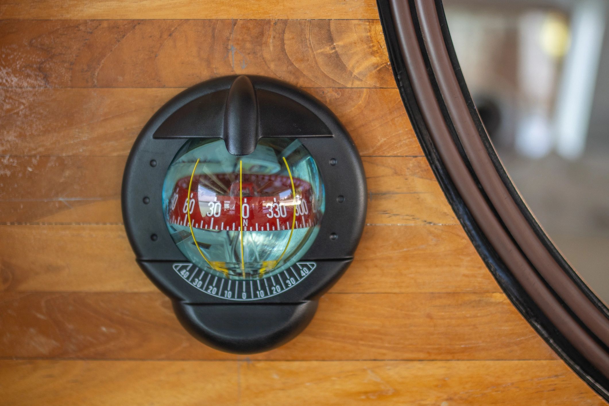 Marine compass on a navigation chart