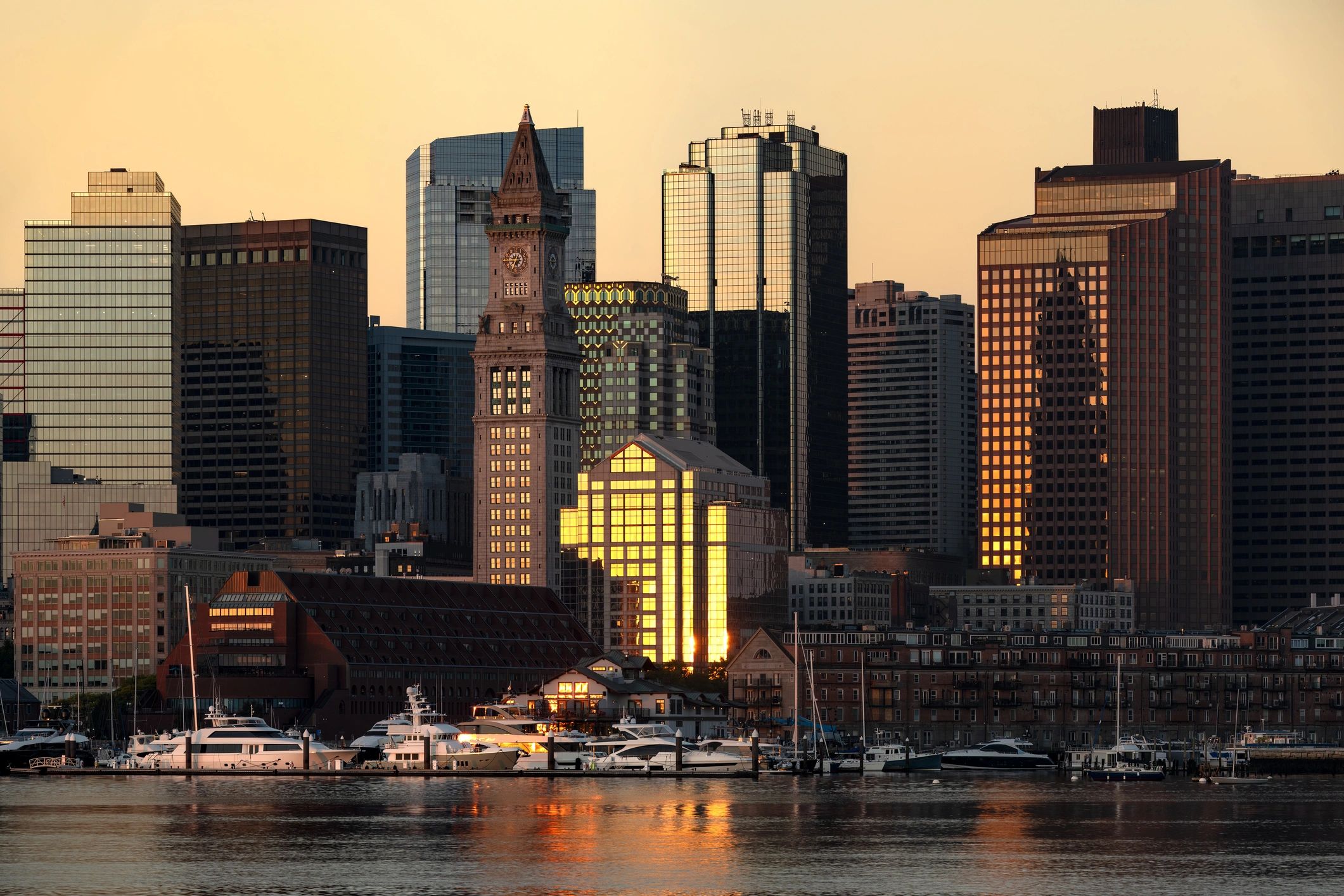 Coastal city waterfront skyline at sunrise
