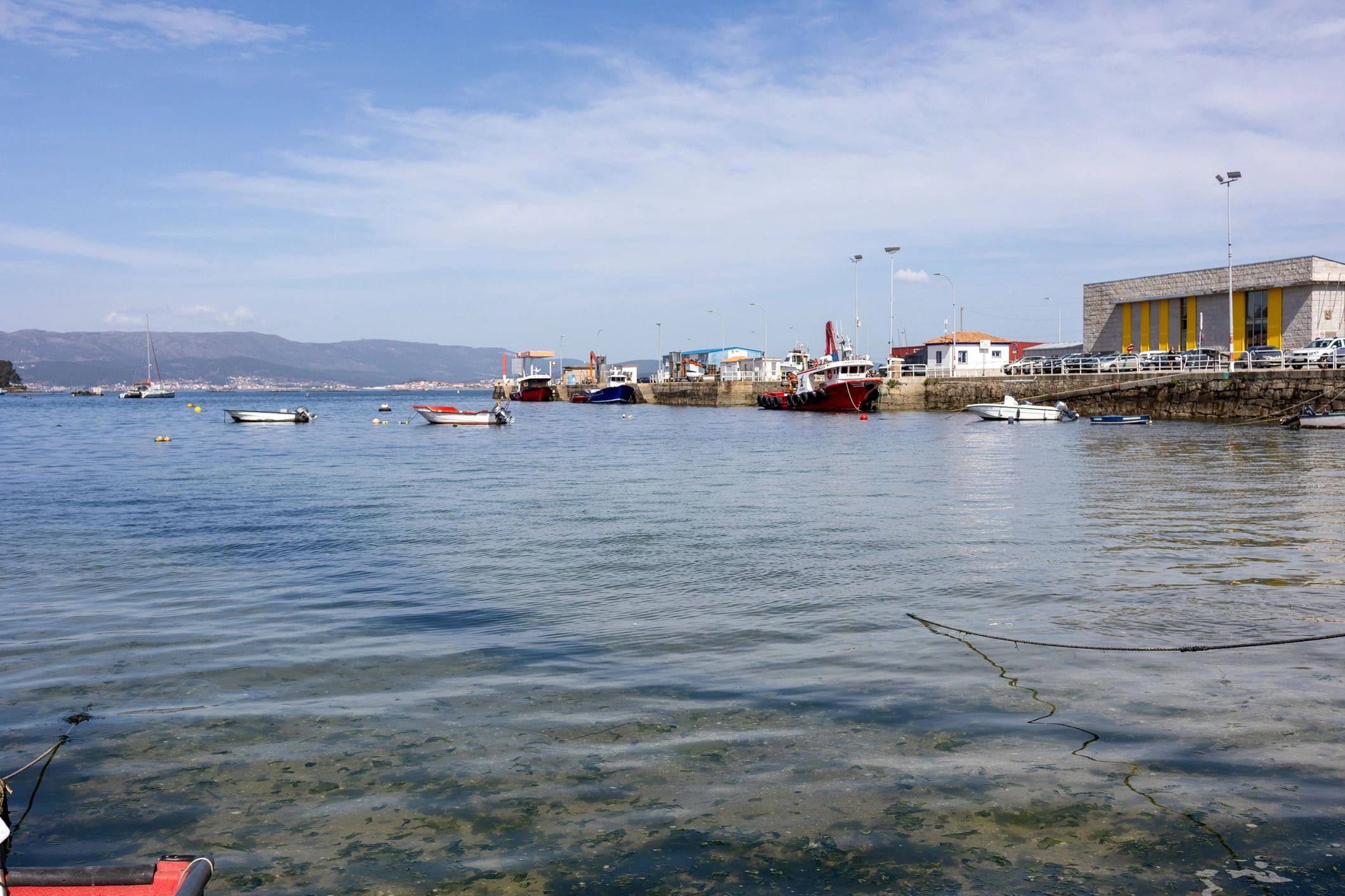 Boats moored in a coastal harbor