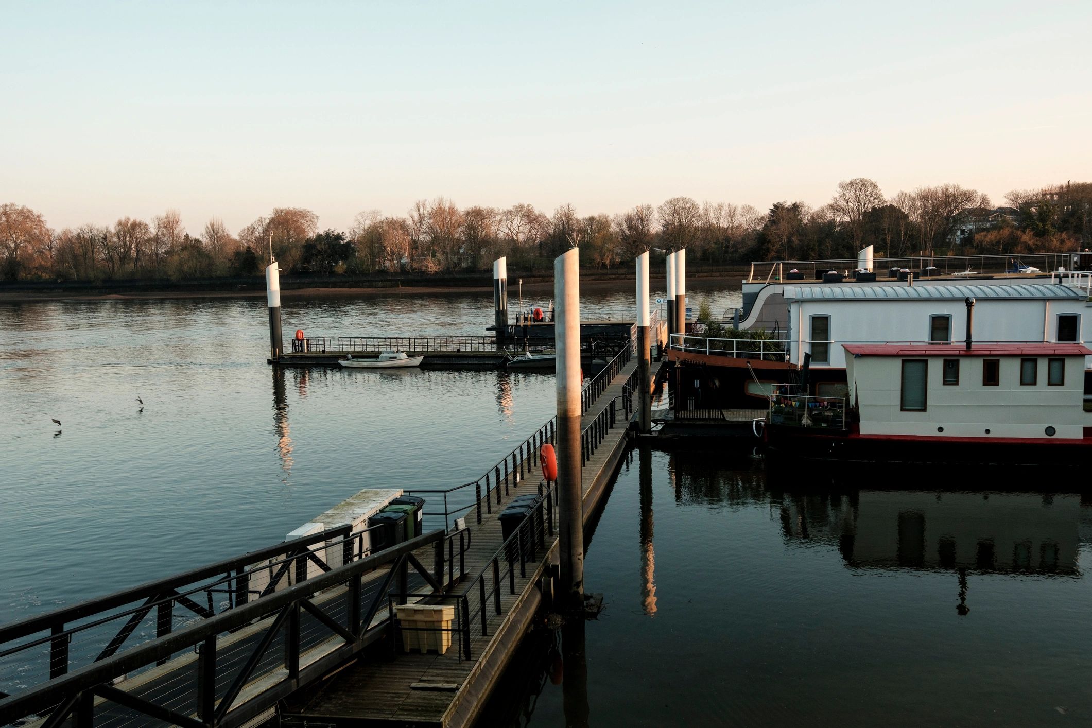 Houseboats moored at a tranquil pier