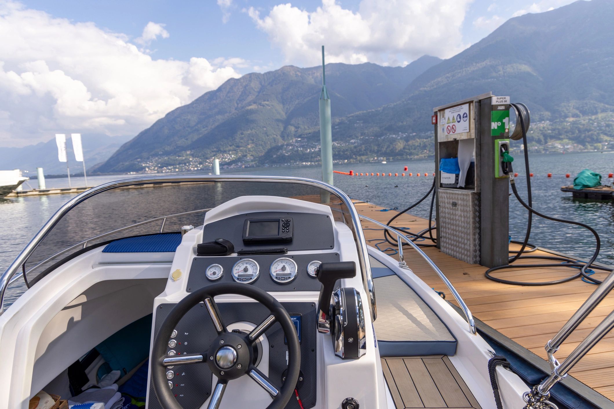 Boat docked at a marina fuel station